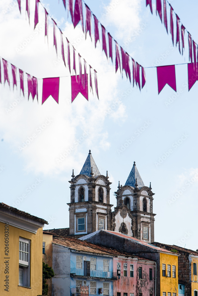 Fototapeta premium Pink flags and church towers in Pelourinho