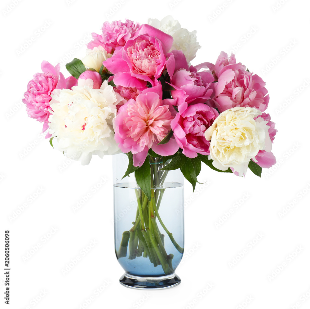 Fototapeta premium Bouquet of colorful peonies with green leaves in vase isolated on white