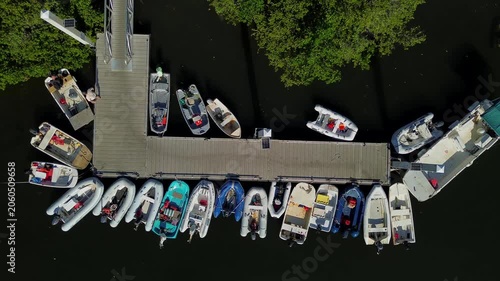 Overhead Drone Shot of Inflatable Boats - Dinghies at  Wooden Pier in the marina