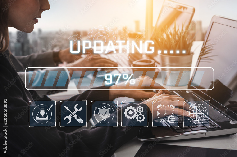 Fototapeta premium Modern Workspace with User Updating Software on Laptop with Progress Bar and Digital Icons Representing Technology and Productivity in a Bright Environment Sigmoid
