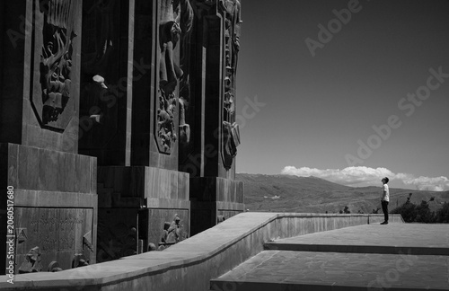 Man Contemplating the Monumental Chronicles of Georgia in Tbilisi