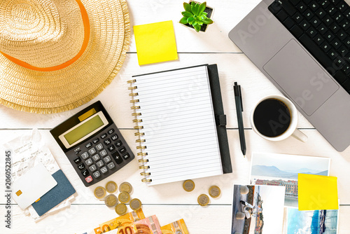 Travel vacation financial planning desk flat lay