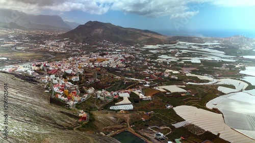 Aerial wide circling view of Galdar town and volcanic valley, Gran Canaria