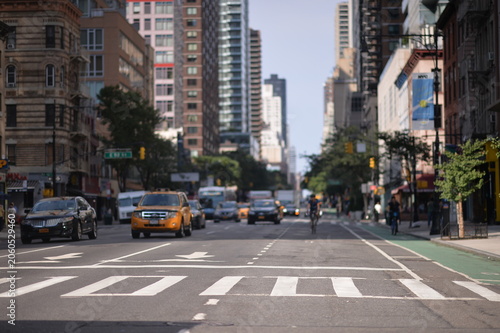 Urban City Street Scene with Taxis and Cyclist