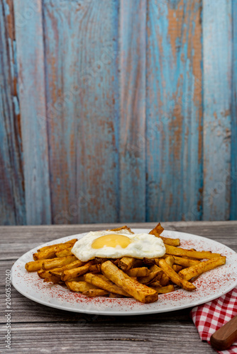 Fried egg and french fries on plate