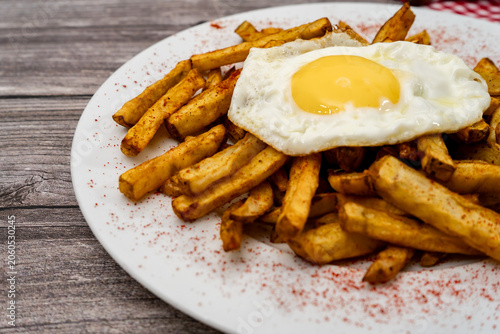 Fried egg on crispy french fries