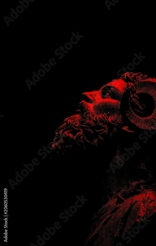Dramatic red low-key profile portrait of a horned mythological statue on a solid black back