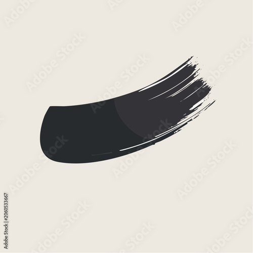Black brush stroke on a light background