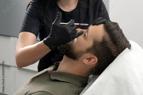 Konstfotografi Beauty injections into young male face