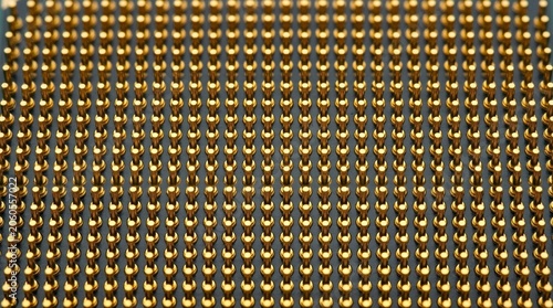 Close-up view of a computer processor's gold pins arranged in a precise grid pattern