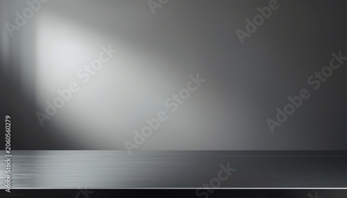 Silver steel countertop, empty shelf. Kitchen counter on gray background with spot light. Bar desk surface in foreground 