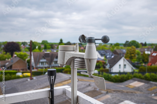 Bild auf Leinwand Home weather station anemometer on balcony railing measuring wind speed and dire