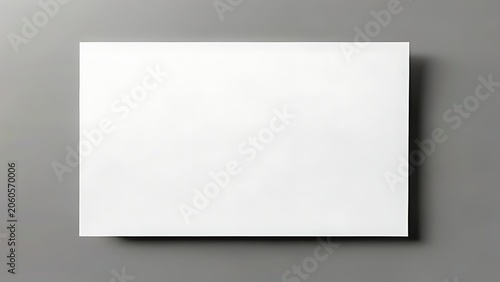 Blank horizontal rectangular paper sheet floating mockup with soft drop shadow on grey backdrop for branding presentation