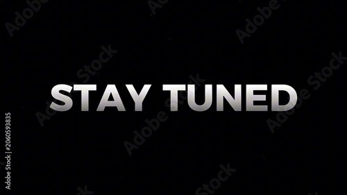 Dynamic 'STAY TUNED' message in metallic silver against a stark black background, symbolizing anticipation and a forthcoming announcement
