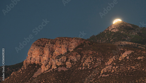 Moon setting behind the Huachuca Mountains just before dawn