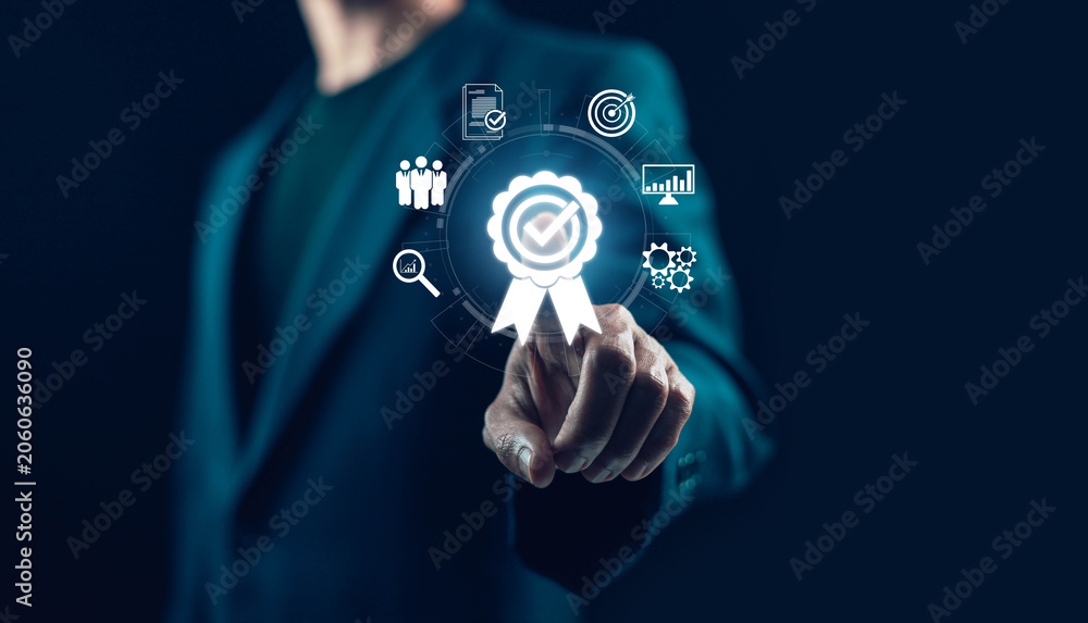 Fotografie Businessman selecting quality assurance certification on virtual interface