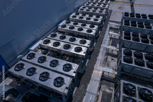 Aerial view of Hyperscale Datacenter, AI data center cooling systems, piping electrical equipment. Chilling equipment and electrical substations generators