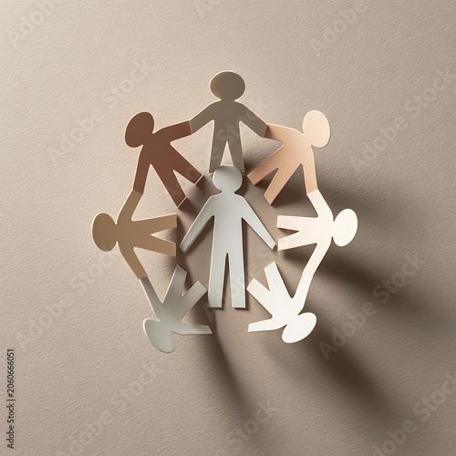 Paper people chain symbolizing unity and diversity on a beige background.