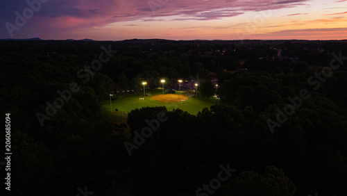 Obraz na plátně A lit up softball field at Mill Woods Park in Wethersfield, Connecticut at sunse