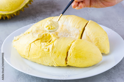 Eating Thai Golden Pillow durian flesh with a spoon