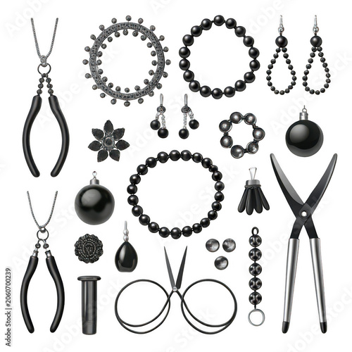 Black jewelry making supplies and tools laid out on white background