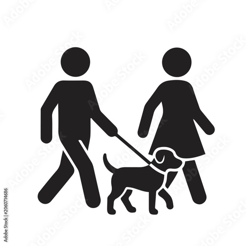 man and woman walking dog on leash together outdoors