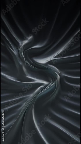 Dark, flowing, abstract fabric texture with gentle swirling motion