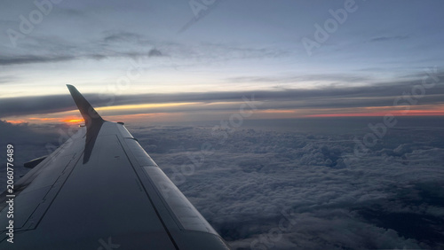 Sunset above the clouds from plane