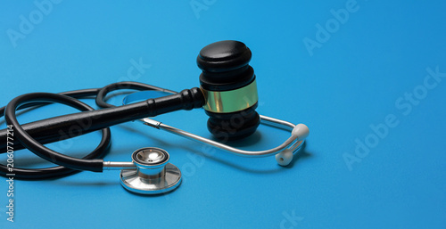 Fotografie Solemn concept of ethical medicine law justice represented by black gavel and st