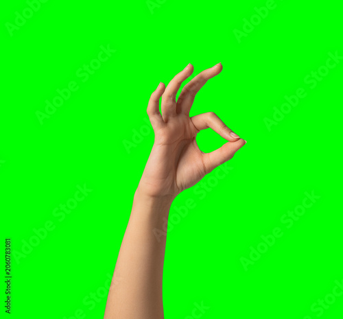 Women hand gesture chef kiss okay great isolated on green screen