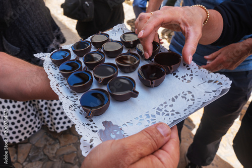 Принти на полотні Crowd assembles for shots of traditional Portuguese sour morello cherries sweete