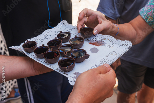 Tableau sur toile Crowd assembles for shots of traditional Portuguese sour morello cherries sweete