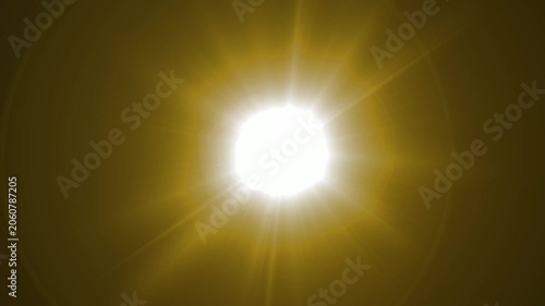 Abstract bright light burst with optical lens flare,Bright explosion of fire and light in a starry night sky with a optical lens flare.