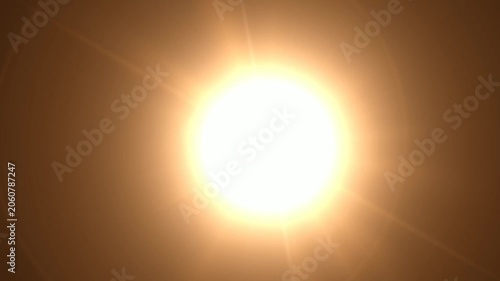 Abstract bright light burst with optical lens flare,Bright explosion of fire and light in a starry night sky with a optical lens flare.