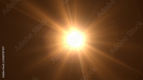 Abstract bright light burst with optical lens flare,Bright explosion of fire and light in a starry night sky with a optical lens flare.