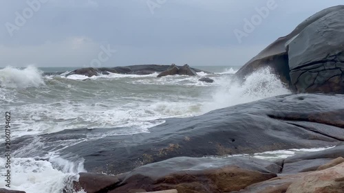 Waves and giant rocks at the Stone Park in Hainan, China