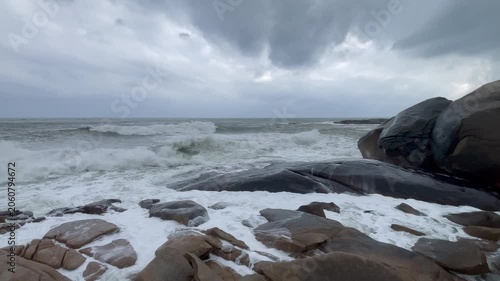 Waves and giant rocks at the Stone Park in Hainan, China