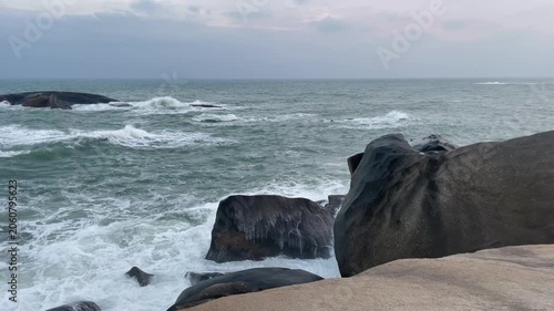 Waves and giant rocks at the Stone Park in Hainan, China