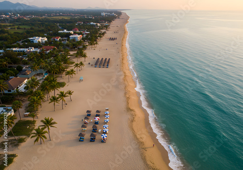 Tropical beach sunrise aerial view