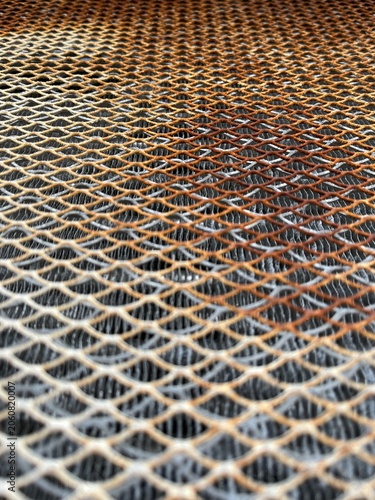 Rusty Metal Grate Pattern with Industrial Texture Background.