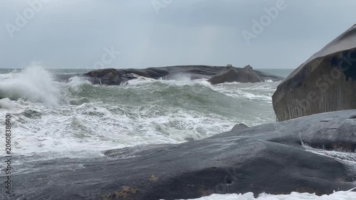 Waves and giant rocks at the Stone Park in Hainan, China