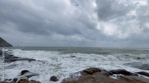 Waves and giant rocks at the Stone Park in Hainan, China