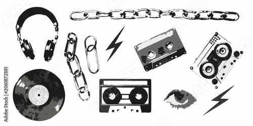 Collection of punk themed objects including headphones vinyl record and cassette tapes in grayscale