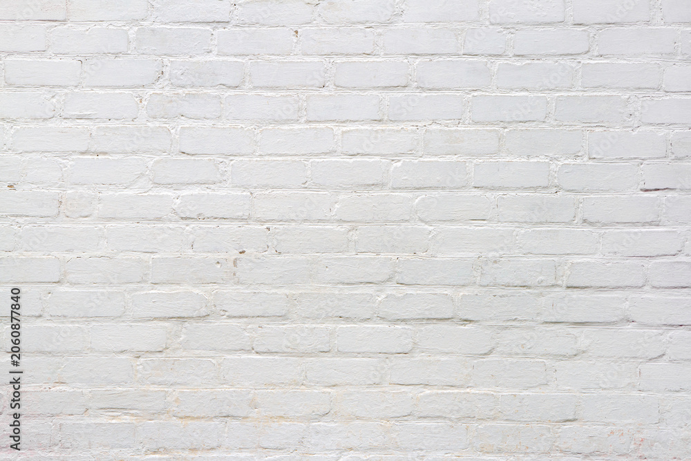 Fototapeta premium White brick wall background. Texture of painted masonry surface. Architectural backdrop for interior design and construction projects.