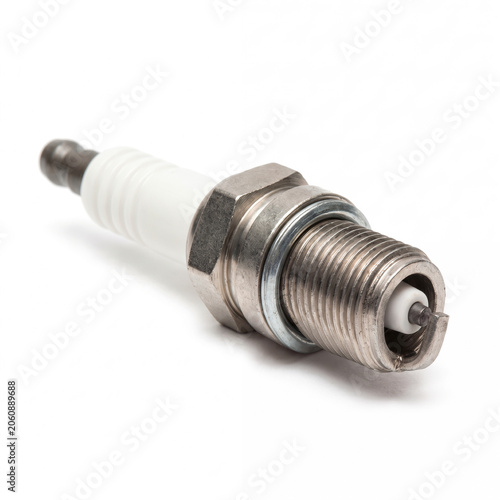 Standard automotive spark plug unlit isolated on white background.