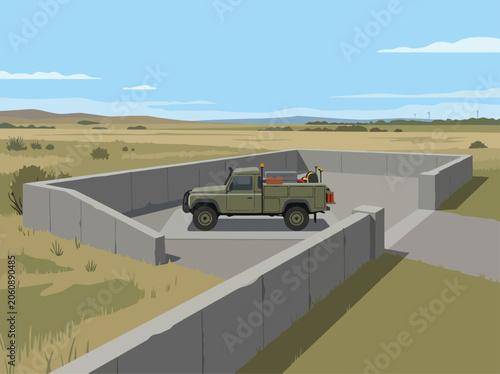 Foto A remote outpost maintenance vehicle sits within a concrete structure, overlooking a vast, open landscape