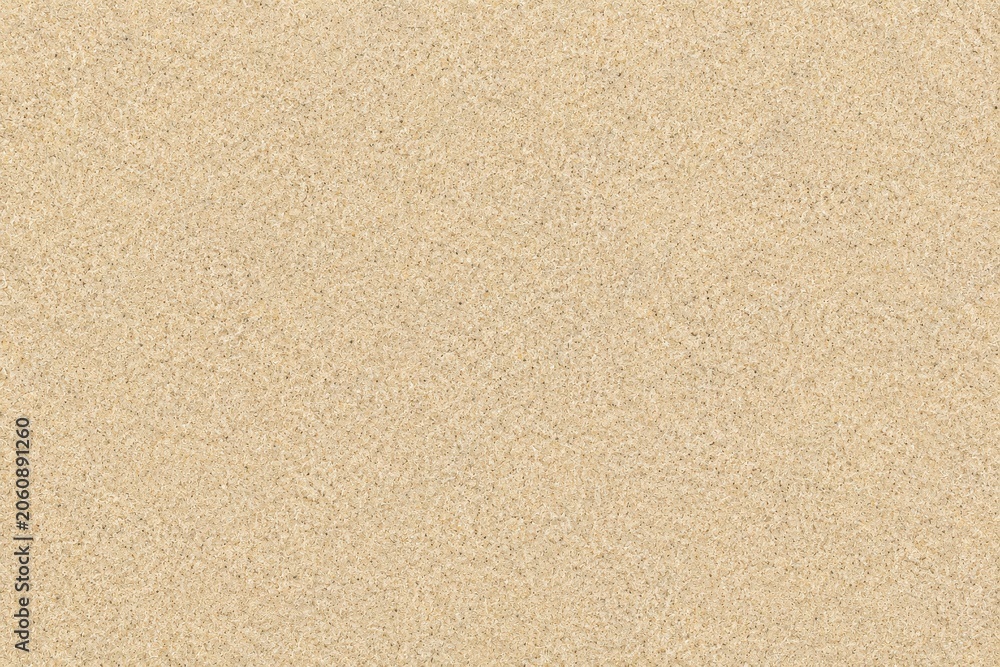 Fototapeta premium Seamless texture of fine beige sand grains for background or design