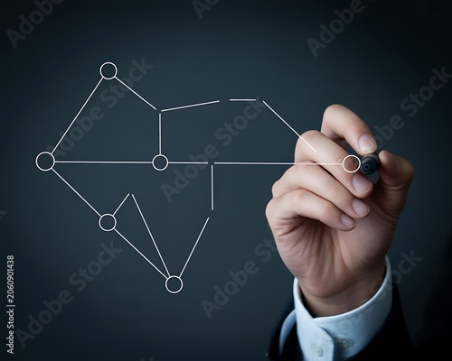 Businessman Drawing Flowchart on Blackboard