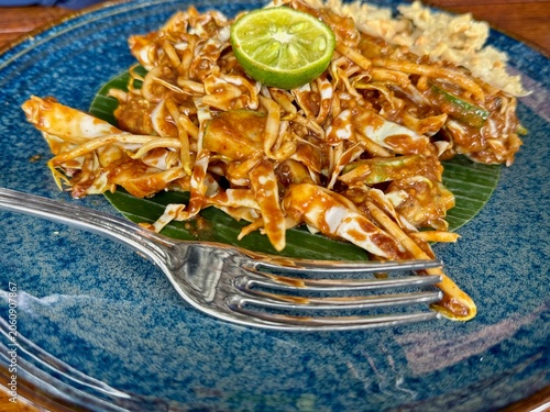 Raw vegetable salad with peanut sauce and kaffir lime