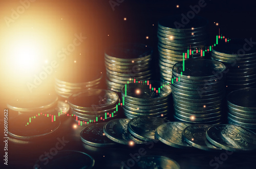 Stacked coins and bullish candlestick chart illustrating financial growth, investment opportunities, wealth management and increasing market value. Perfect business finance and trading background.